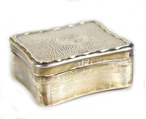 SOTHERS, ORCHARD &amp; CO; an Edwardian hallmarked silver trinket box of rounded rectangular form, the engine turned decorate