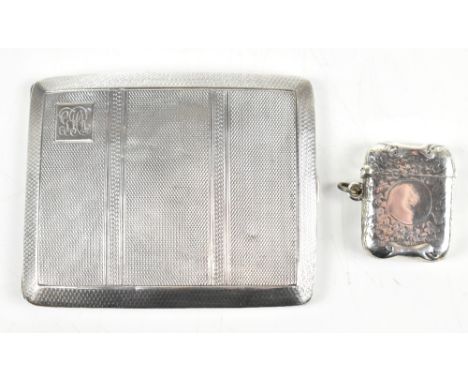 WILMOT MANUFACTURING COMPANY; a George V hallmarked silver cigarette case of rounded rectangular form, with engine turned dec