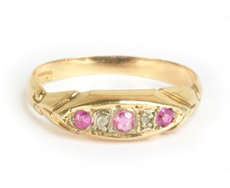 An 18ct yellow gold diamond chip and ruby five stone ring, size L, approx 1.7g.Additional InformationThe band is quite worn, 