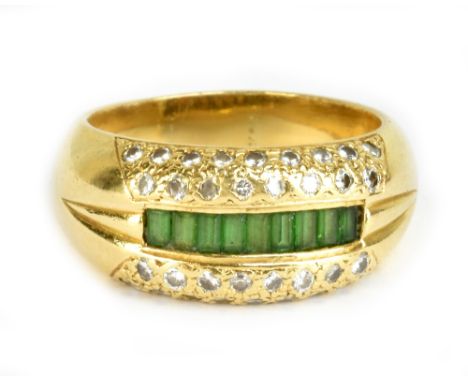 An 18ct yellow gold emerald and diamond ring, the central panel of baguette cut emeralds flanked by twin rows of diamonds, si