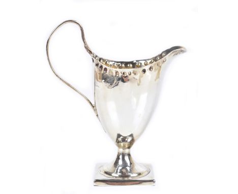 A George III hallmarked silver helmet shaped cream jug, with simple loop handle and stepped square section foot, maker's mark