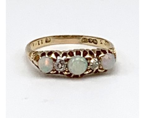 An 18ct yellow gold opal and diamond five stone ring, approx 3.5g.