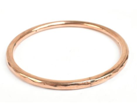 A 9ct yellow gold wax filled bangle, diameter 8.3cm.