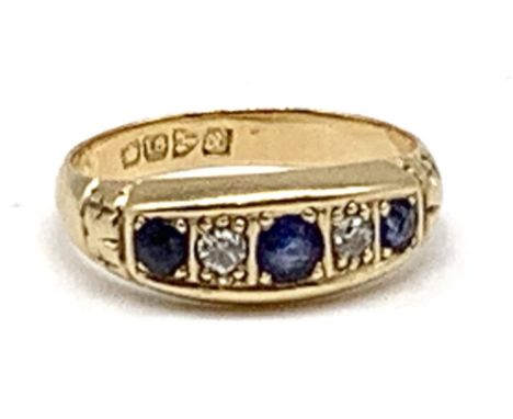 An 18ct yellow gold five stone diamond and sapphire ring, Chester hallmark, approx 3.9g.Additional InformationSome light surf