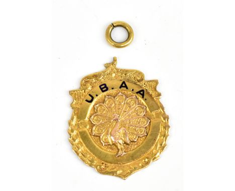 U.B.A.A.; a yellow metal and enamel decorated pendant centered with a peacock and inscribed to the reverse 'Senior League 1st
