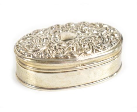 ADIE &amp; LOVEKIN; an Edwardian hallmarked silver trinket box of oval form, the embossed hinged lid with central vacant cart