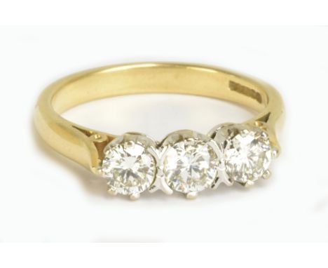 An 18ct yellow gold three stone diamond ring, each brilliant cut stone weighing approx 0.20cts, ring size P, approx 4.6g.Addi