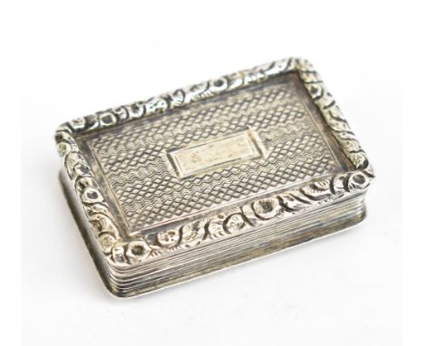 JOHN LAWRENCE &amp; CO; a George IV hallmarked silver vinaigrette of rectangular form, with cast floral beaded edge surroundi