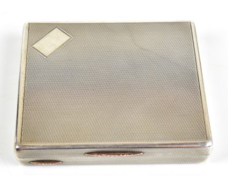 A NICHOLS &amp; SON; a George V hallmarked silver cigarette case of rectangular form with engine turned detail, with single r