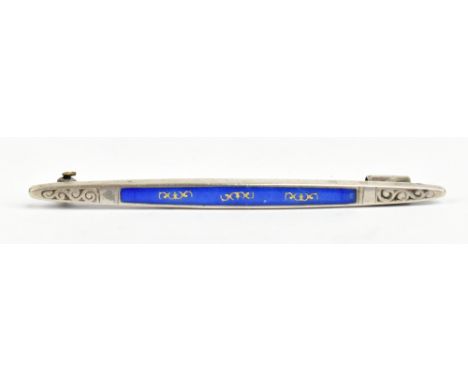 A white metal and blue enamel decorated bar brooch with gilt heightening to the panel of enamel, length 7cm.Additional Inform