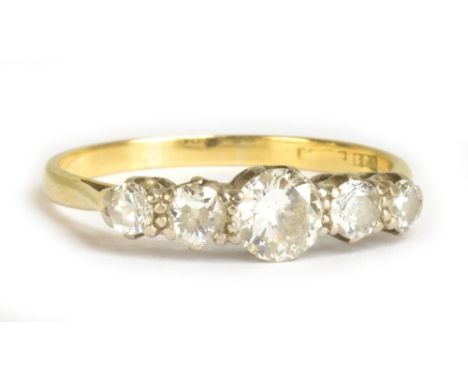 A yellow metal five stone diamond ring, the central diamond weighing 0.50cts, size Q 1/2, approx 2.8g.Additional InformationT
