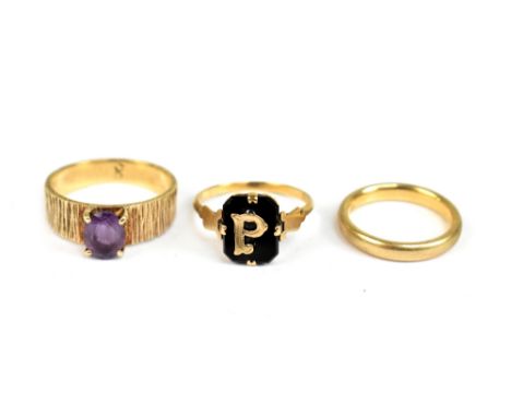 Three 9ct yellow gold rings comprising wedding band, a textured amethyst dress ring, signet ring, largest size P, approx 8.2g