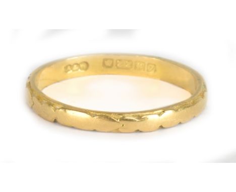 A 22ct yellow gold wedding band, size O, approx 2.5g.Additional InformationThere is rubbing to the decoration, there seems to