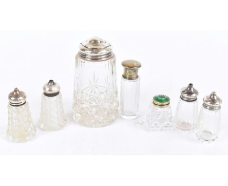 A group of silver topped clear glass sifters, peppers and vanity jars including&nbsp;guilloché enamelled example (several af)