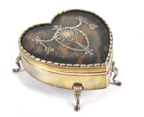 WILLIAM COMYNS; an Edwardian hallmarked silver and inlaid tortoiseshell heart shaped trinket box, the hinged lid decorated wi