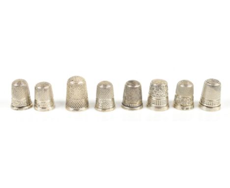 CHARLES HORNER; a group of eight hallmarked silver thimbles including examples with engine turned decoration and floral bands