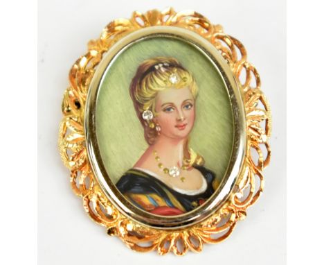 A yellow metal pendant centered with the oval portrait of a young woman and with 18ct yellow gold bail, length 4.25cm, approx