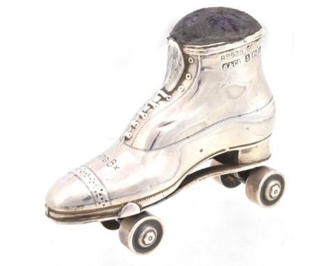SPURRIER &amp; CO LTD; an Edward VII hallmarked silver novelty pin cushion in the form of a roller skate, Birmingham 1909, re
