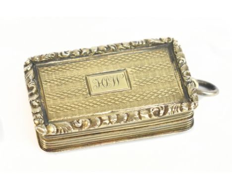 NATHANIEL MILLS; a William IV hallmarked silver vinaigrette of curved rectangular form with cast beaded rim and engine turned