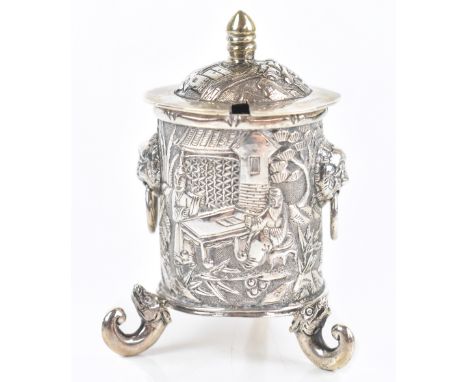 LUEN WO OF SHANGHAI; a Chinese silver cylindrical lidded salt with hinged domed cover and twin lion mask ring handles, emboss