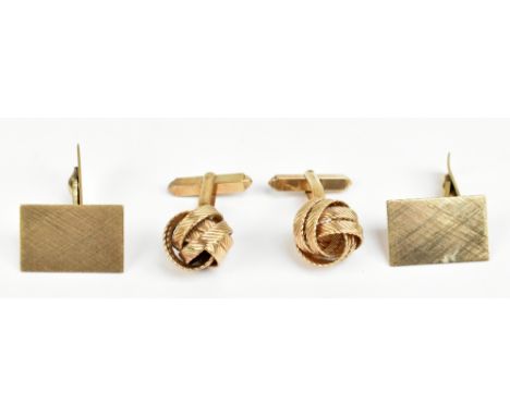 A pair of 9ct yellow gold cuff links with ball surmounts, with chased detail, and a further pair of yellow metal stamped '333