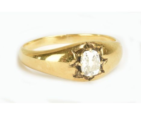 A yellow metal and diamond solitaire ring, the oval cut stone in eight claw setting, ring size R 1/2, approx 4.9g.Additional 