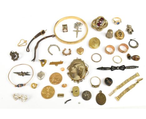 A quantity of costume jewellery including a bangle, brooches, pendants, also a damaged silver thimble, etc.Additional Informa