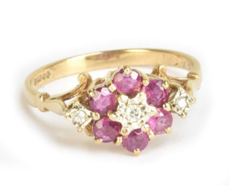 A 9ct yellow gold ruby and diamond floral dress ring, size P, approx 2.3g.Additional InformationMinor surface wear but basica