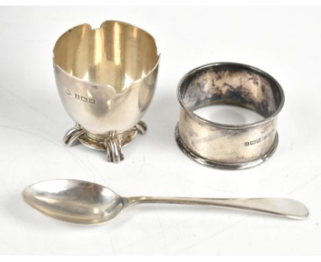 A hallmarked silver matched three piece christening set comprising egg cup by Adie Bros, Birmingham 1950, similar spoon, Birm