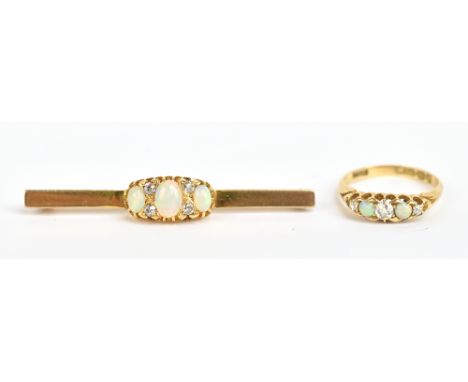 An 18ct yellow gold five stone opal and diamond ring, size N and a similarly decorated yellow metal bar brooch, length 5.5cm,