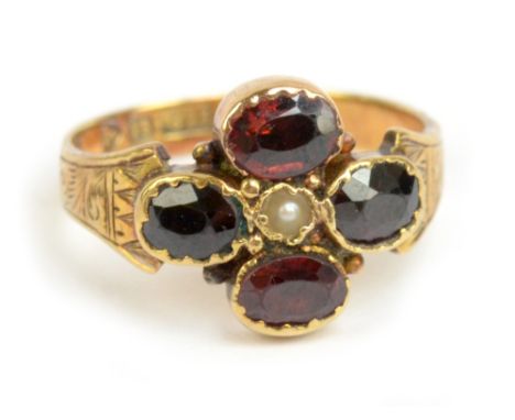 An Edwardian 15ct yellow gold garnet and pearl ring with engraved details to the shoulders, Chester 1902, size L, approx 2.9g