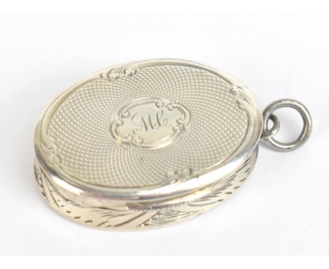 FREDERICK MARSON; a Victorian hallmarked silver vinaigrette of oval form, with engine turned detail surrounding a oval cartou