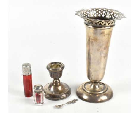 A small group of variously hallmarked silver items including a George V hallmarked silver spill vase with loaded base, a squa