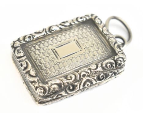 TAYLOR &amp; PERRY; a William IV hallmarked silver vinaigrette of rounded rectangular form, with a cast floral edge surroundi