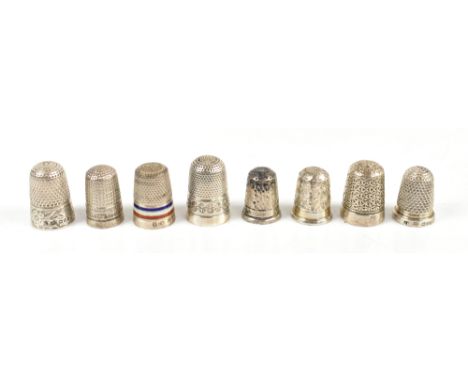 CHARLES HORNER;&nbsp; a group of eight hallmarked silver thimbles including a red, white and blue enamel banded thimble, a Do