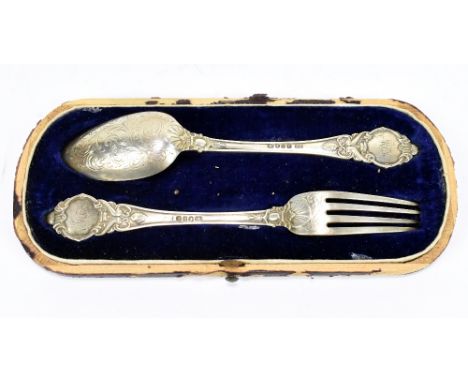 JOHN GILBERT; a Victorian hallmarked silver christening fork and spoon set, with chased and cast detail, Birmingham 1852, fit