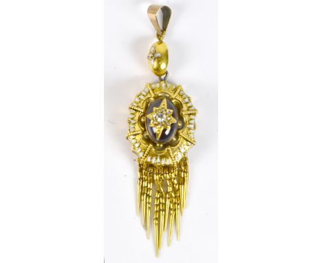 A Victorian yellow metal enamel decorated pendant set with a cabochon garnet and diamond (formerly an earring), length 6cm, a