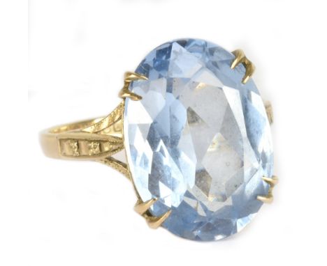 A 9ct yellow gold dress ring, set with a large blue synthetic stone, size M, approx 4.3g.