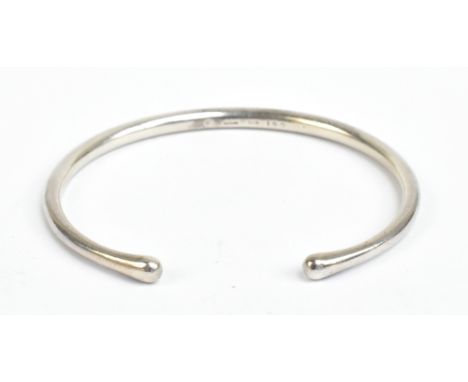 GEORG JENSEN; a silver torque bangle, fully marked and no.150, external width 7cm, internal width approx 6cm, approx 18.5g.Ad