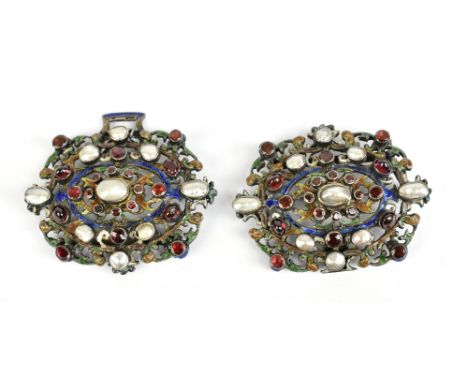 An interesting Arts &amp; Crafts style white metal enamel decorated buckle set with mother of pearl and garnets in a pierced 