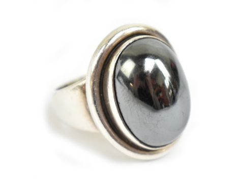 GEORG JENSEN; a silver and hematite cabochon ring, 46A, with maker's mark and stamped 925 Denmark to the reverse, size O 1/2,