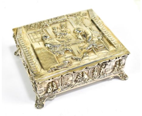 THOMAS HAYES; an Edwardian hallmarked silver rectangular lidded trinket box, embossed throughout with figures in various purs