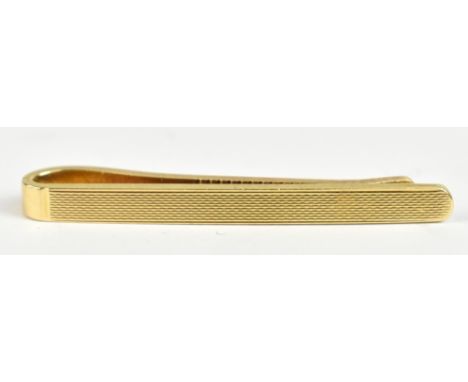 A 14ct yellow gold tie clip with engine turned decoration, length 4.5cm, approx 6.6g.Additional InformationGeneral wear, scra