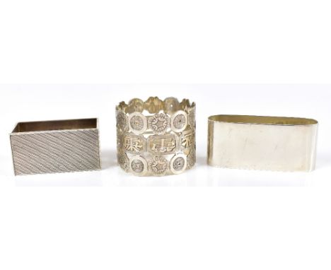 JOHN ROSE; a George VI hallmarked silver napkin ring of rectangular form with engine turned and Art Deco decoration, Birmingh