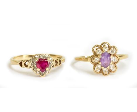 A 9ct yellow gold dress ring with heart-shaped pink central stone and pierced shoulders, size R and a further 9ct yellow gold