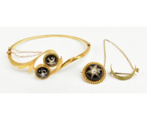 A Victorian 15ct gold garnet cabochon and diamond set hinged bangle, with twin cabochons centred with a diamond and five furt