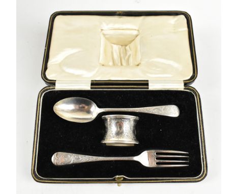 JOHN ROUND; an Edward VII hallmarked silver matched three piece christening set, comprising spoon and fork with chased detail