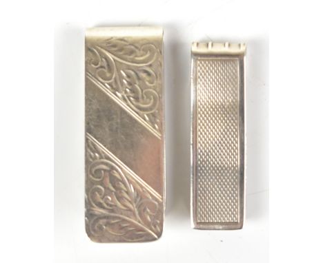 M KAMIN &amp; CO LTD; an Elizabeth II hallmarked silver money clip with chased detail, Birmingham 2003, length 5.3cm, and a f
