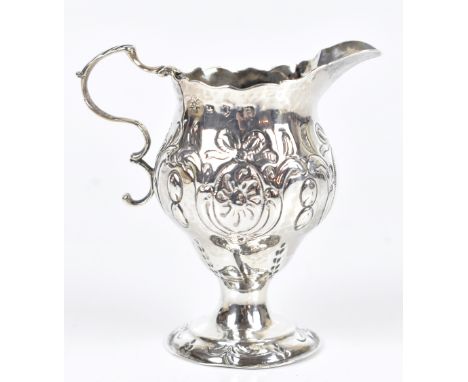 NATHANIEL APPLETON &amp; ANN SMITH; a George III hallmarked silver helmet shaped cream jug, with double loop handle and embos