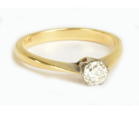 An 18ct yellow gold, platinum tipped diamond solitaire ring, the round brilliant cut diamond weighing approx 0.22cts in six c